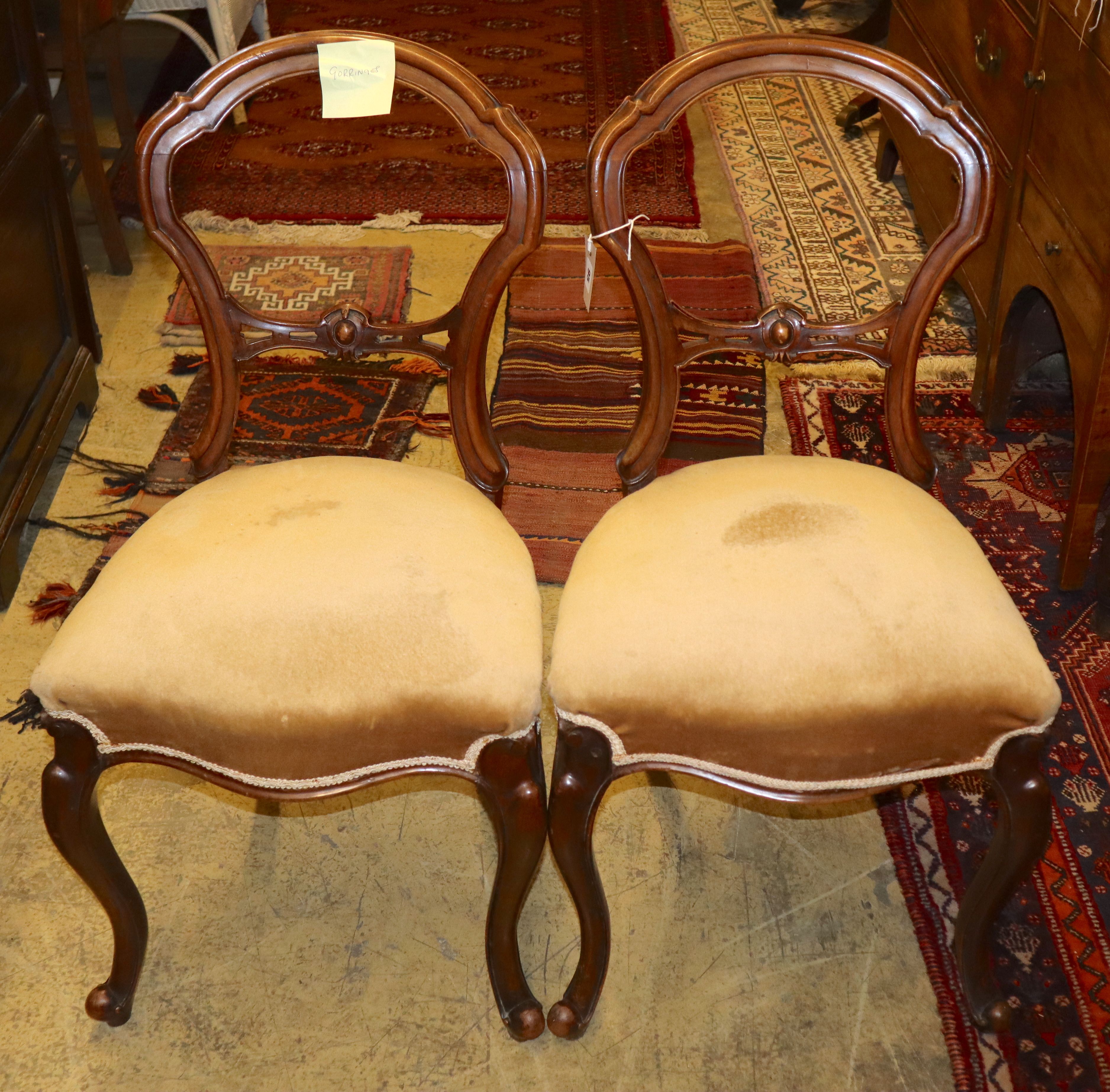 A set of six Victorian mahogany dining chairs, on cabriole legs